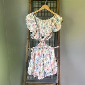 Romper size small with open sides and back